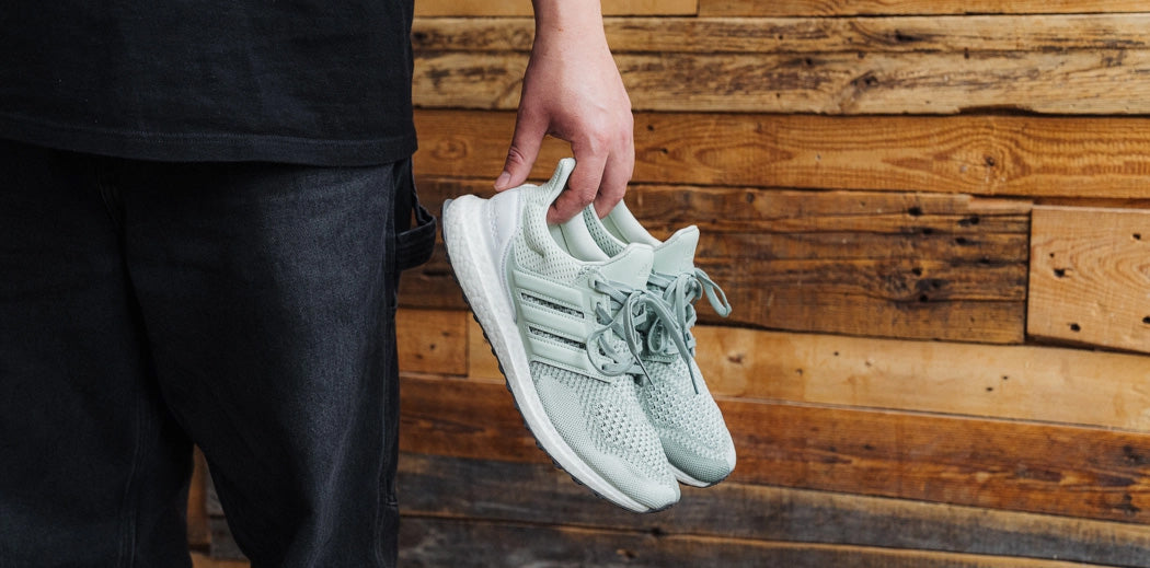 Step up your sneaker game with the adidas UltraBoost in grey. These kicks are all about style and performance