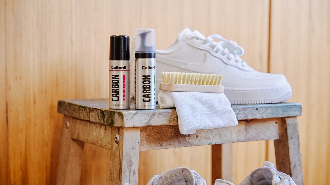 Collonil shoe care product next to white sneakers