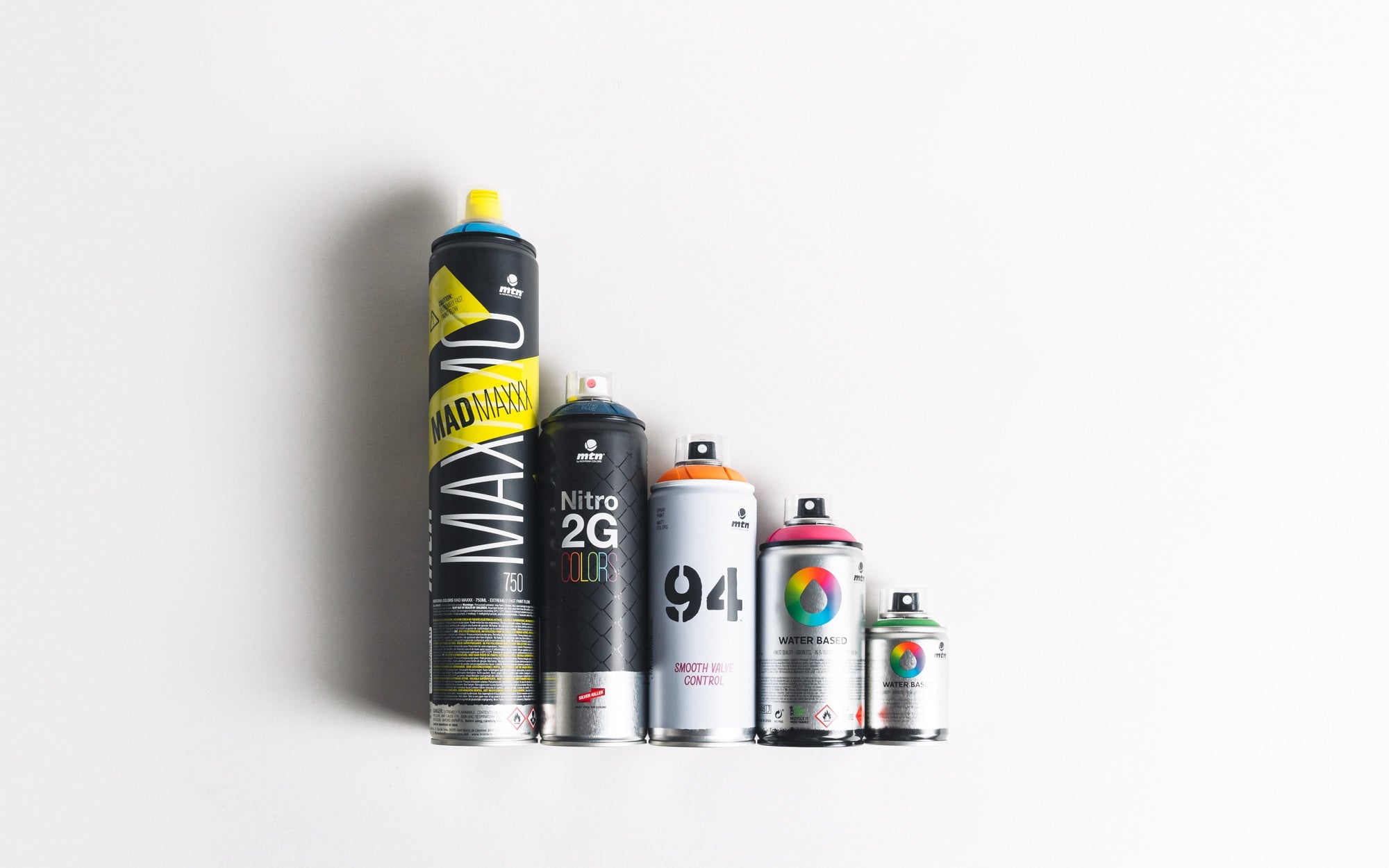 Various MTN spray cans in different colors and sizes.