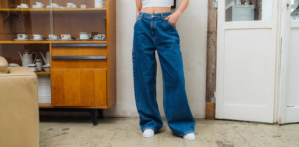 Stylish Carhartt workwear denim cargo pants, perfect for women's jeans apparel.