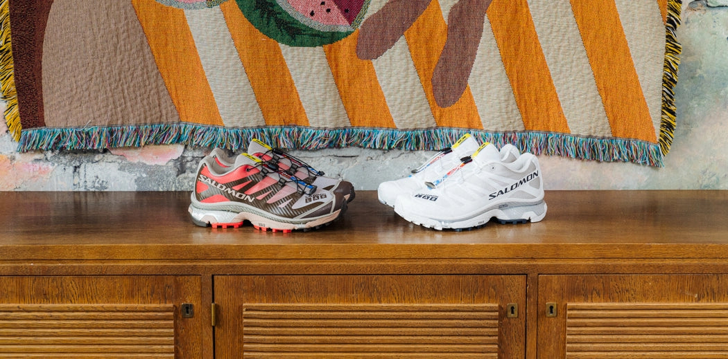  A pair of Salomon running shoes and sneakers side by side, ready for a workout or casual wear.
