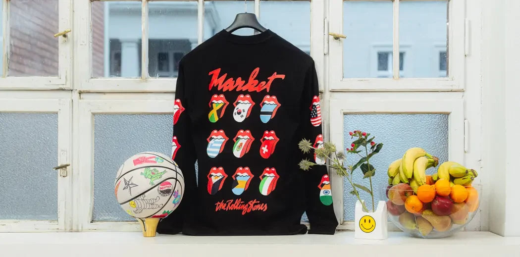 Rolling Stones long sleeve shirt by Chinatown Market Apparel displayed on a window sill.