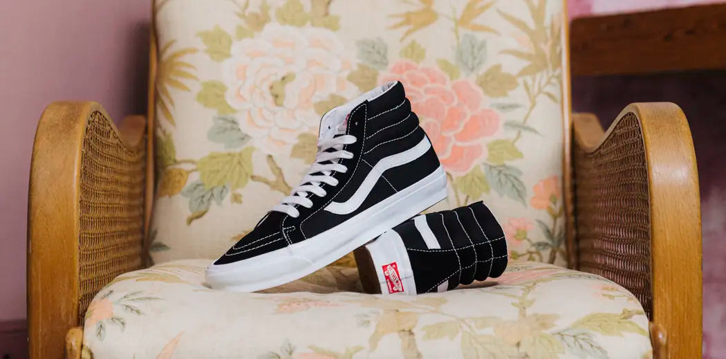 Vans Sk8-Hi sneakers in classic black and white color scheme. Perfect for a stylish and versatile look.