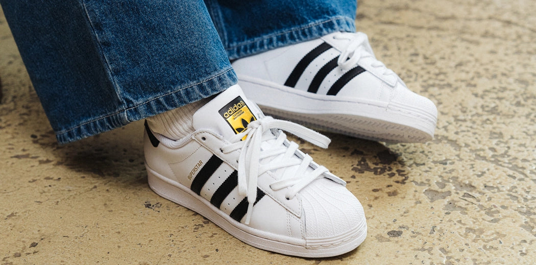 Classic adidas Superstar 80s sneakers in white and black colorway.
