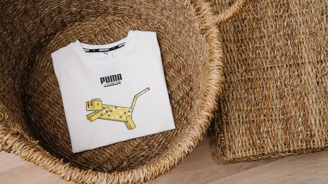 Kids' t-shirt with a yellow cat design, adding a playful touch to their outfit.