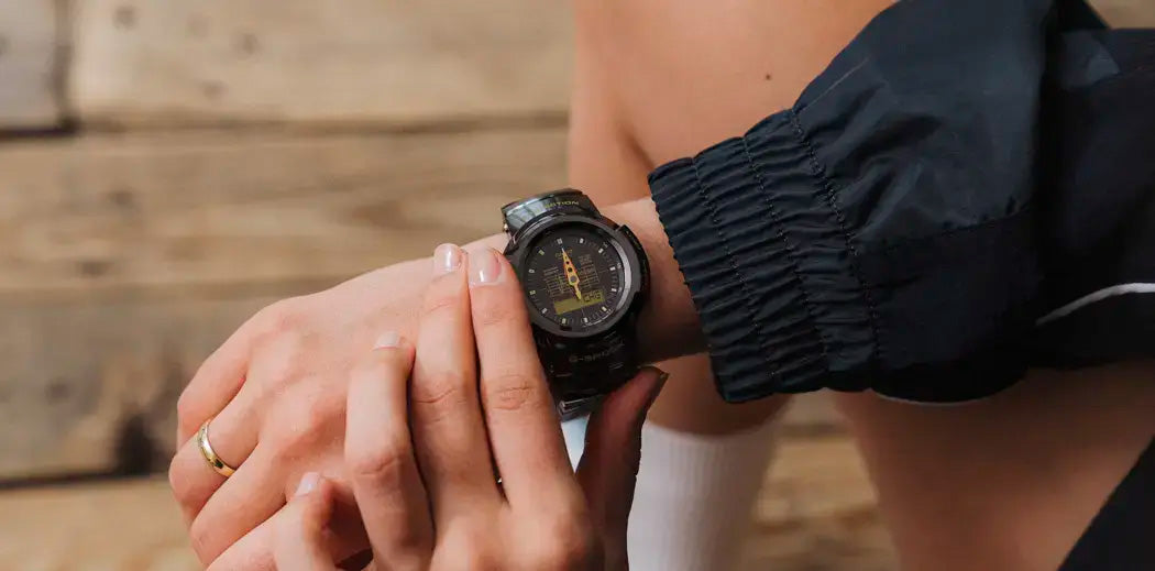 A person watching the time on his  G-Shock watch